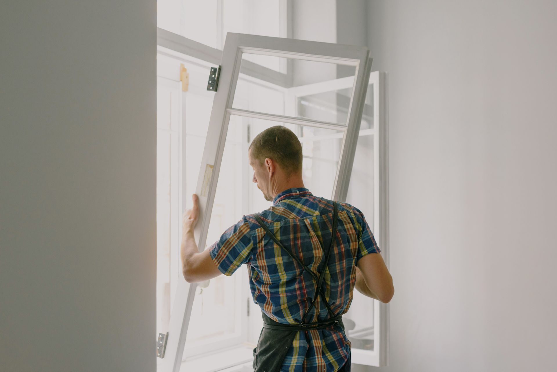 Technician installing a window
